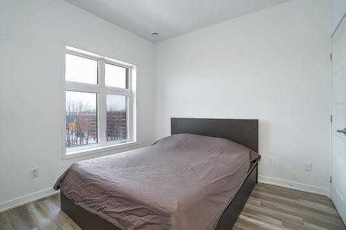 Chambre à coucher - 702-9185 Rue Lennon, Brossard, QC - Indoor Photo Showing Bedroom