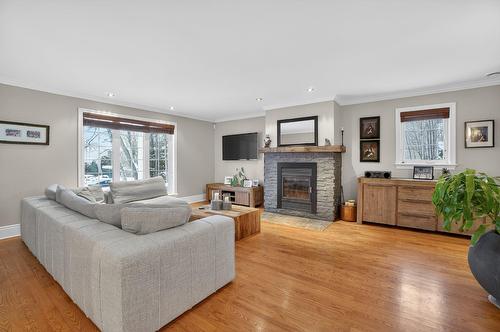 Living room - 147 Rue Gaudreau, Saint-Jérôme, QC - Indoor Photo Showing Living Room With Fireplace