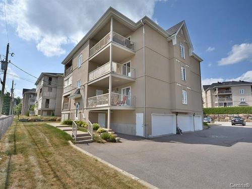 Garage - 401-2460 Boul. Lafontaine, Saint-Jérôme, QC - Outdoor With Facade