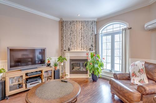 Salon - 401-2460 Boul. Lafontaine, Saint-Jérôme, QC - Indoor Photo Showing Living Room With Fireplace