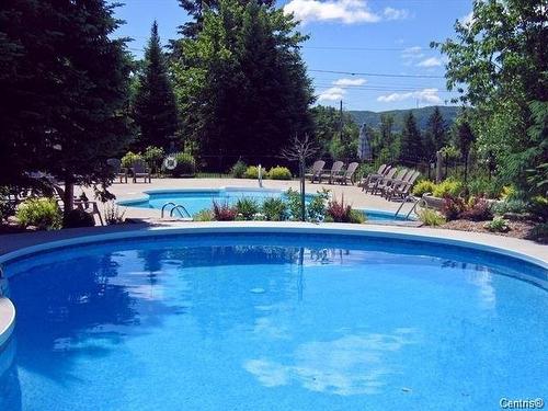 Piscine - 1808 Ch. Du Golf, Mont-Tremblant, QC - Outdoor With In Ground Pool With Backyard
