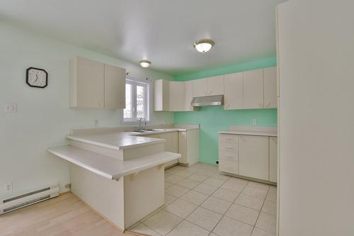 Kitchen - 53 Rue Des Pléiades, L'Épiphanie, QC - Indoor Photo Showing Kitchen With Double Sink