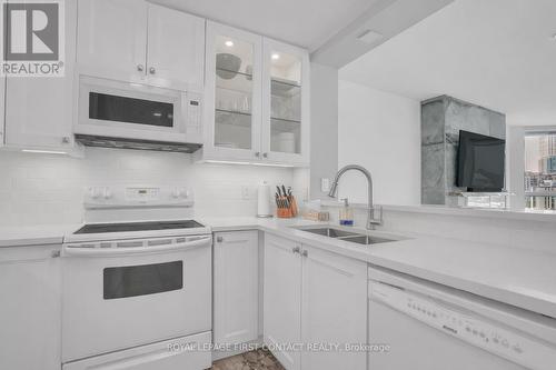 605 - 140 Dunlop Street E, Barrie, ON - Indoor Photo Showing Kitchen With Double Sink