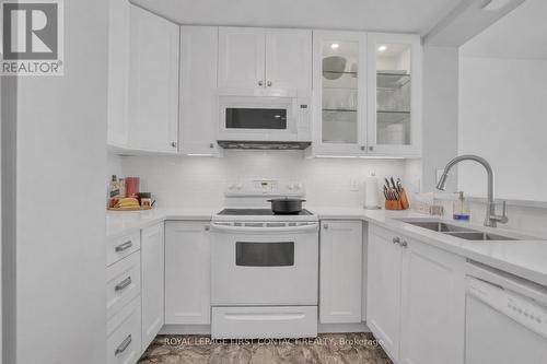 605 - 140 Dunlop Street E, Barrie, ON - Indoor Photo Showing Kitchen With Double Sink