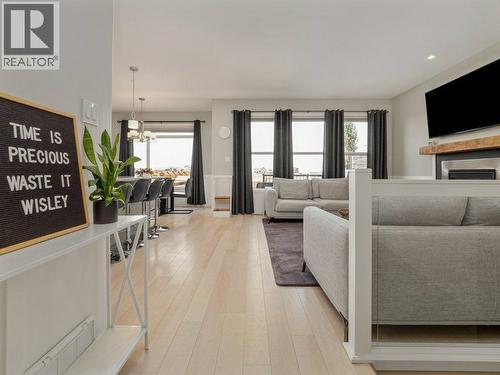 102 Blackwolf Bay N, Lethbridge, AB - Indoor Photo Showing Living Room With Fireplace