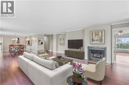 Virtually Staged - 20 Berkley Road Unit# 702, Cambridge, ON - Indoor Photo Showing Living Room With Fireplace