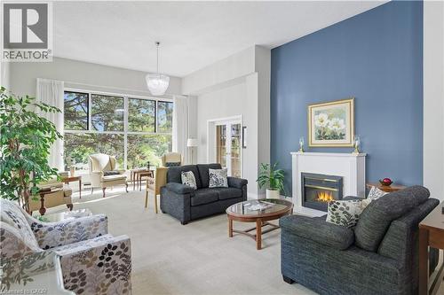 20 Berkley Road Unit# 702, Cambridge, ON - Indoor Photo Showing Living Room With Fireplace
