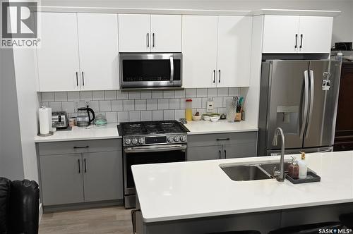 148 Rosewood Boulevard E, Saskatoon, SK - Indoor Photo Showing Kitchen With Double Sink