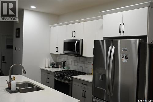 148 Rosewood Boulevard E, Saskatoon, SK - Indoor Photo Showing Kitchen With Stainless Steel Kitchen With Double Sink With Upgraded Kitchen