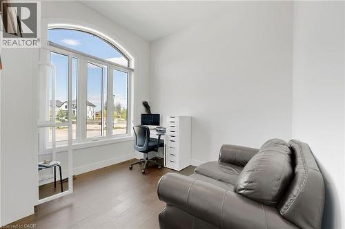 Office space featuring wood finished floors and baseboards - 7266 Silver Creek Circle, London, ON - Indoor