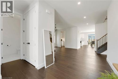 Corridor featuring stairway, dark wood-type flooring, and recessed lighting - 7266 Silver Creek Circle, London, ON - Indoor Photo Showing Other Room