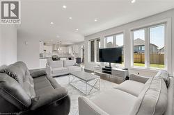 Living room featuring recessed lighting and light wood-style floors - 