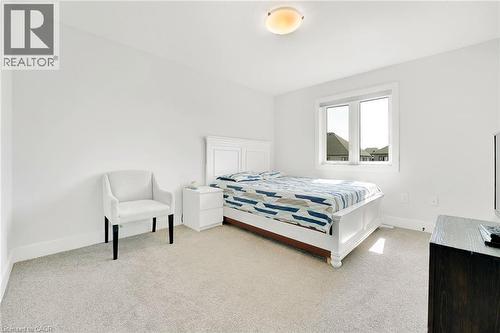 Bedroom with carpet floors - 7266 Silver Creek Circle, London, ON - Indoor Photo Showing Bedroom