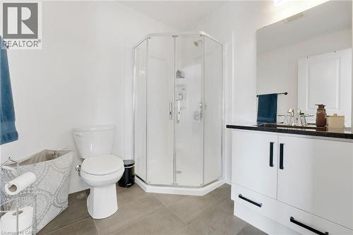 Full bathroom with a stall shower, vanity, and light tile patterned flooring - 7266 Silver Creek Circle, London, ON - Indoor Photo Showing Bathroom