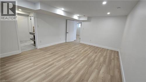 Finished basement featuring light wood-style floors and recessed lighting - 7266 Silver Creek Circle, London, ON - Indoor Photo Showing Other Room