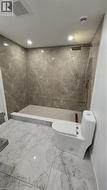 Full bath with a marble finish shower, marble tiled floors, and recessed lighting - 