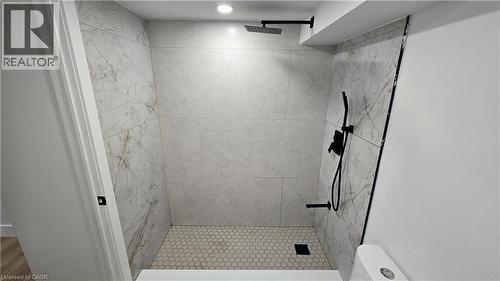 Full bath featuring a stall shower and toilet - 7266 Silver Creek Circle, London, ON - Indoor Photo Showing Bathroom