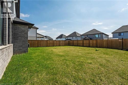 Fenced backyard featuring a residential view - 7266 Silver Creek Circle, London, ON - Outdoor