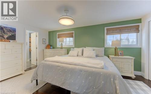 Primary has large windows overlooking backyard and park - 51 Nathaniel Crescent, Kitchener, ON - Indoor Photo Showing Bedroom