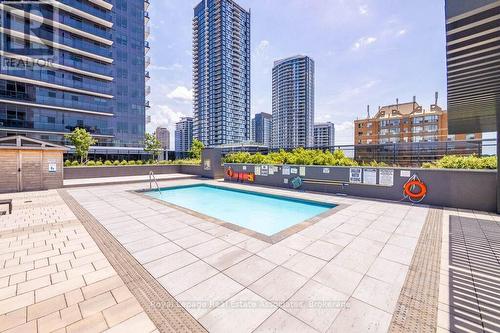 124 - 8 Nahani Way, Mississauga, ON - Outdoor With In Ground Pool