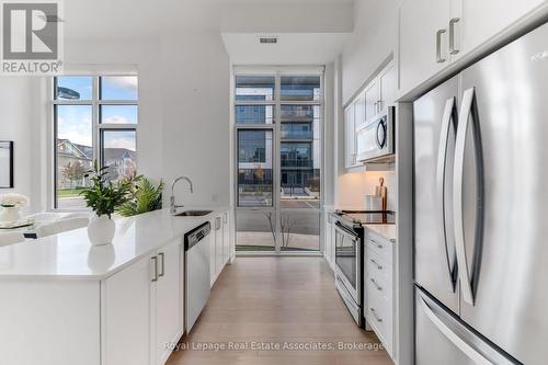 124 - 8 Nahani Way, Mississauga, ON - Indoor Photo Showing Kitchen With Upgraded Kitchen