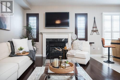 318 Malboeuf Court, Milton, ON - Indoor Photo Showing Living Room With Fireplace