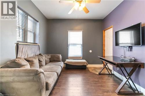 Living room featuring wood type floors and a ceiling fan - 112 Eagle Avenue, Brantford, ON - Indoor Photo Showing Other Room