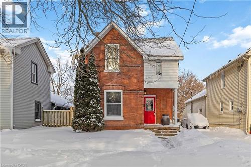 Front of home featuring driveway, walk up to front door, and lawn. - 112 Eagle Avenue, Brantford, ON - Outdoor