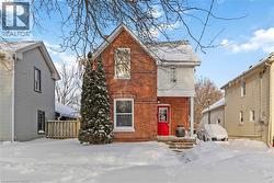 Front of home featuring driveway, walk up to front door, and lawn. - 
