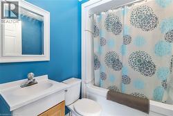 Bathroom with vanity and shower / bathtub combination - 