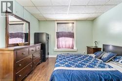 Bedroom with wood type floors - 