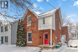 Front of home featuring driveway, walk up to front door, and lawn. - 