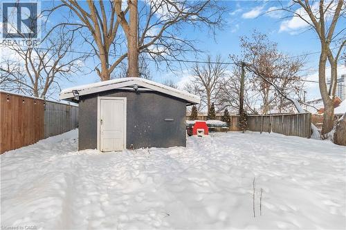 Large fenced yard featuring the shed - 112 Eagle Avenue, Brantford, ON - Outdoor