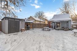 Large yard featuring a patio area, deck, and storage - 