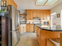 Maple cabinetry with granite countertops - 