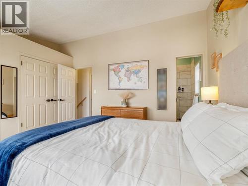 His and hers double closets in primary - 90 Chippewa Crescent W, Lethbridge, AB - Indoor Photo Showing Bedroom