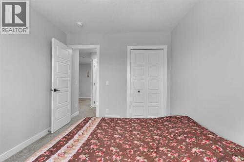 67 Corner Glen Gardens Ne, Calgary, AB - Indoor Photo Showing Bedroom