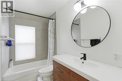 Bathroom with shower / bath combo with shower curtain and vanity - 