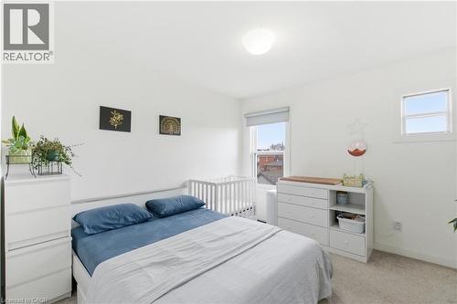 Bedroom with light colored carpet and baseboards - 40 Fullerton Avenue, Hamilton, ON - Indoor Photo Showing Bedroom
