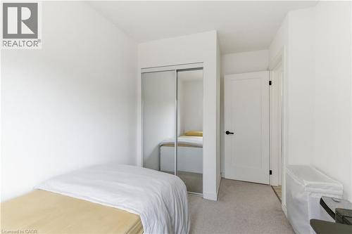 Bedroom with a closet and light colored carpet - 40 Fullerton Avenue, Hamilton, ON - Indoor Photo Showing Bedroom