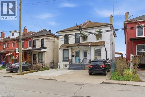 View of front of property with brick siding and a residential view - 40 Fullerton Avenue, Hamilton, ON - Outdoor With Facade
