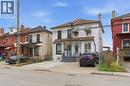 View of front of property with brick siding and a residential view - 40 Fullerton Avenue, Hamilton, ON  - Outdoor With Facade 