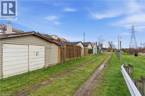 View of dirt / gravel road featuring a residential view - 40 Fullerton Avenue, Hamilton, ON - Outdoor