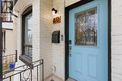 Property entrance featuring brick siding - 