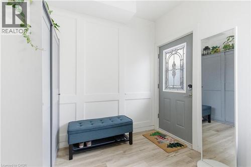 Entryway with light wood-type flooring and a decorative wall - 40 Fullerton Avenue, Hamilton, ON - Indoor