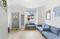 Living area with light wood-type flooring - 