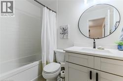 Bathroom with vanity and shower / tub combo - 