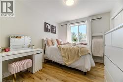Bedroom featuring light wood finished floors - 
