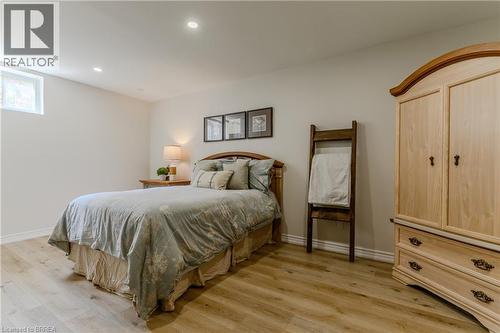 Bedroom with light wood-style floors and recessed lighting - 5 Newport Lane, Port Dover, ON - Indoor Photo Showing Bedroom