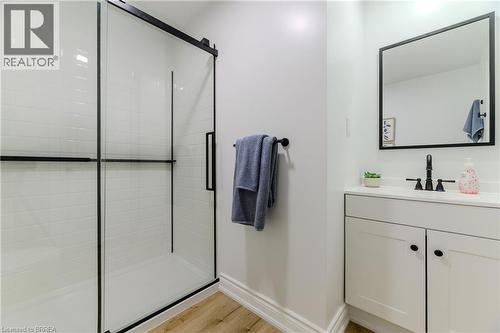 Full bath featuring vanity, a tile shower, and light wood finished floors - 5 Newport Lane, Port Dover, ON - Indoor Photo Showing Bathroom